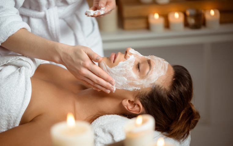 Girl Apply face cream on another Girl face